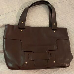 Kate Spade chocolate leather purse with green floral lining